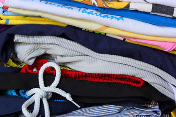 Closeup pile of clothes is rolled