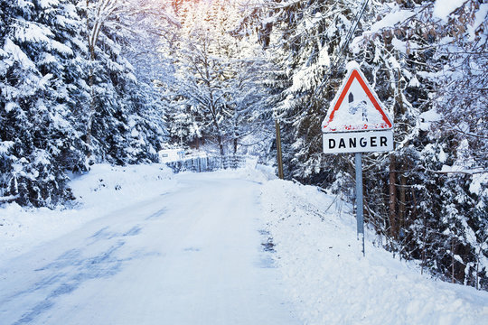danger sign on the frozen road