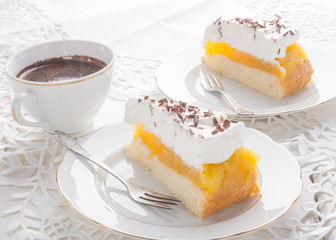 Apple pie with whipped cream and a cup of black coffee