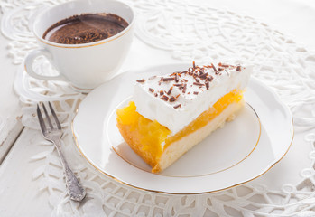 Apple pie with whipped cream and a cup of black coffee