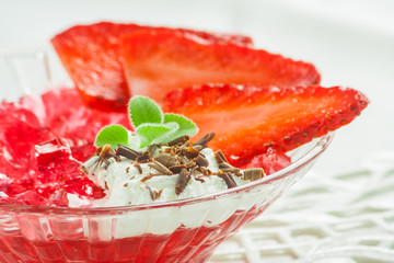 Red jelly with fresh strawberries