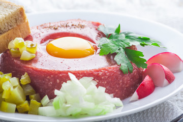 Beef tatar with egg.