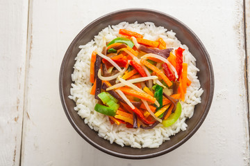 A bowl of rice with vegetables