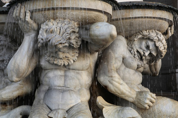 Tritones support the Danube Fountain in Vienna, Austria.