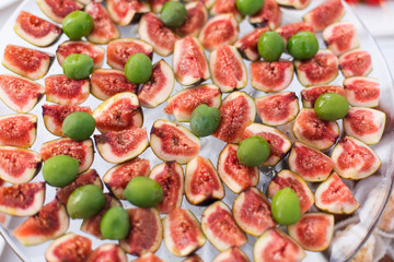 Figs with olives on a plate