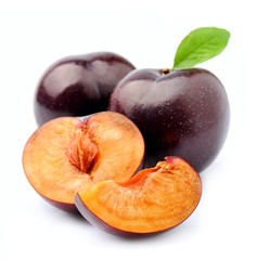 Sweet plums close up on white.