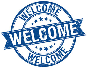 welcome grunge retro blue isolated ribbon stamp