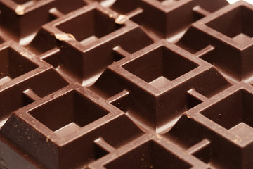 Ornament of big plate of dark chocolate, close up