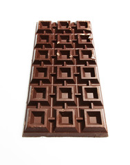 Big plate of dark chocolate on white background