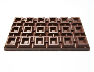 Big plate of dark chocolate on white background
