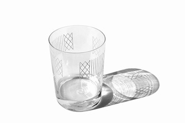 Decorated clear glass with some water isolated