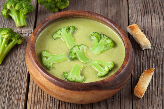 Heathy cream of broccoli green delicious soup with croutons