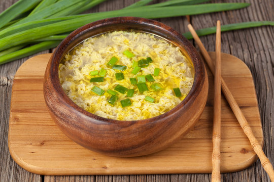 Bowl of  traditional chinese yellow drop egg soup with broth