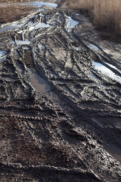 Mud and puddles on the dirt road