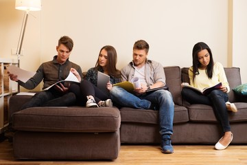 Group of students preparing for exams in apartment interior