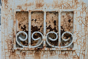 Rusty metal part of a greenhouse door