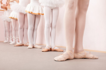 Group of  little ballerinas practicing ballet with their teacher © johoo
