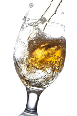 Beer splash in a glass, isolated on white background