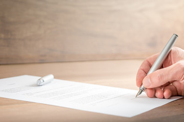 Close up Businessman Signing a Contract Document