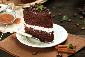 Delicious chocolate cake on table close-up