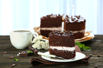 Delicious chocolate cake on table on light background
