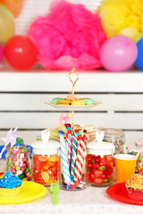 Fototapeta na wymiar Prepared birthday table with sweets for children party