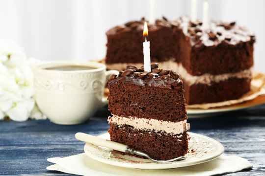 Delicious chocolate cake on table on light background