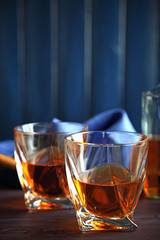 Whiskey on wooden background