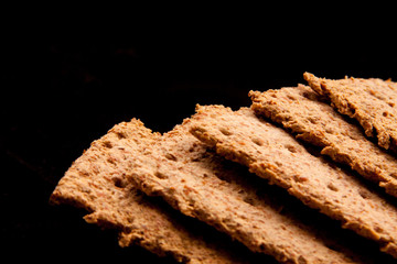 Crispbreads on black background