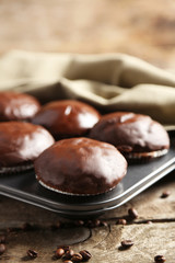 Obraz na płótnie Canvas Tasty homemade chocolate muffins on wooden table