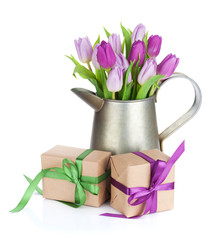 Purple tulip bouquet in watering can and gifts