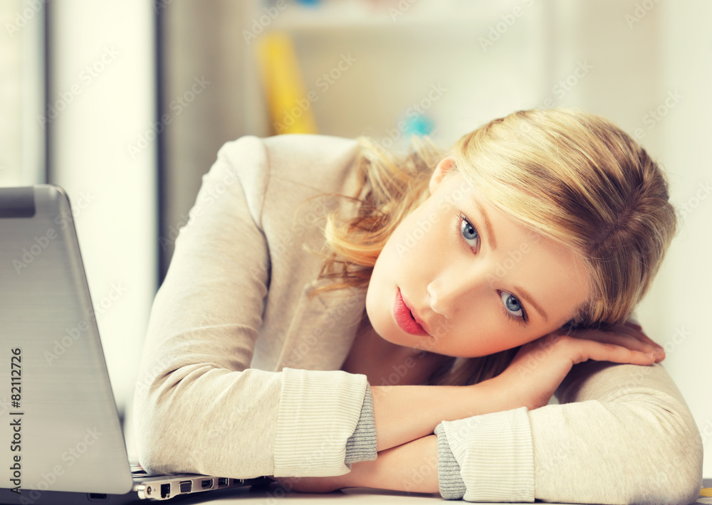 Canvas Prints bored and tired woman behind the table