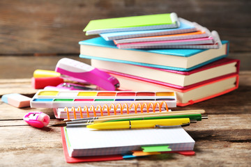 Bright school stationery on old wooden table