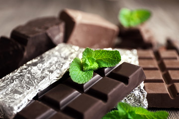 Set of spicy chocolate on wooden table, closeup