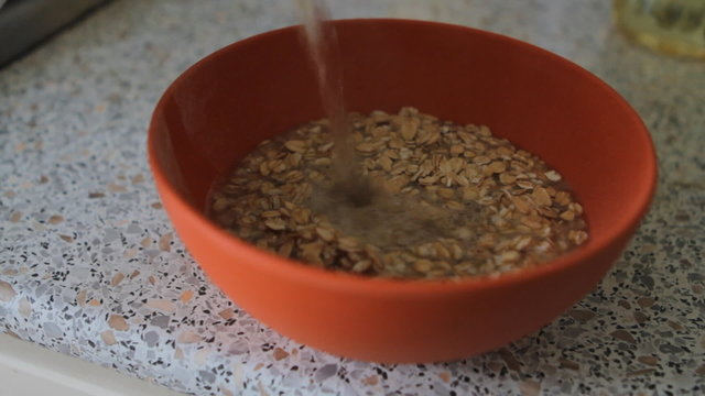 oat flakes in a bowl pour water and stir with a spoon