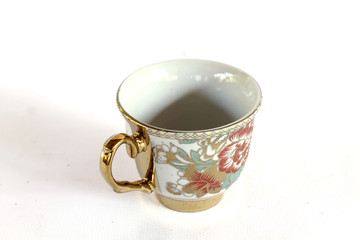 Elegant Antique china tea cup and saucer on white background