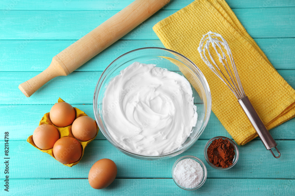 Canvas Prints Whipped egg whites for cream on wooden table, top view