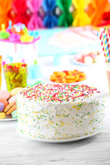 Birthday cake on colorful background