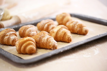 Baking croissant cookies.