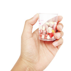hand holdind Colorful tablets with capsules and pills on white b