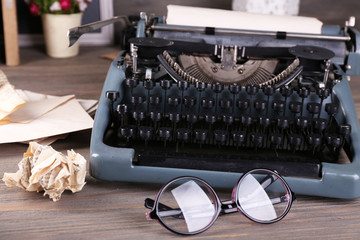 Retro typewriter on wooden table, closeup
