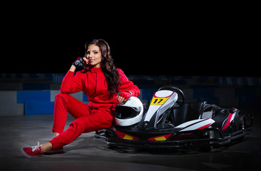 Fototapeta na wymiar Girl racer with kart