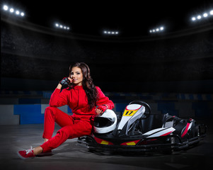 Fototapeta premium Girl racer with kart at stadium