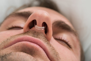Man Face With Nose Clip Device