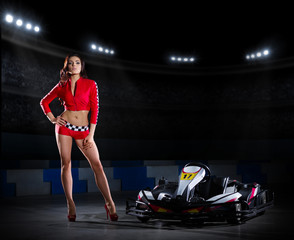 Girl racer with kart at stadium - obrazy, fototapety, plakaty
