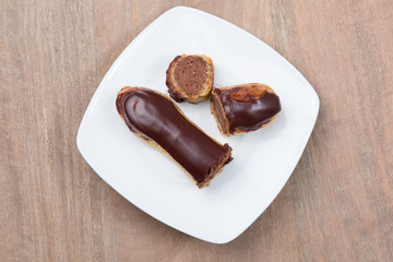 Tasty french chocolate Eclair cut in half