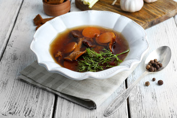 Mushroom soup on wooden background