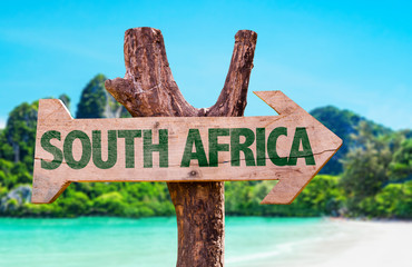South Africa wooden sign with beach background