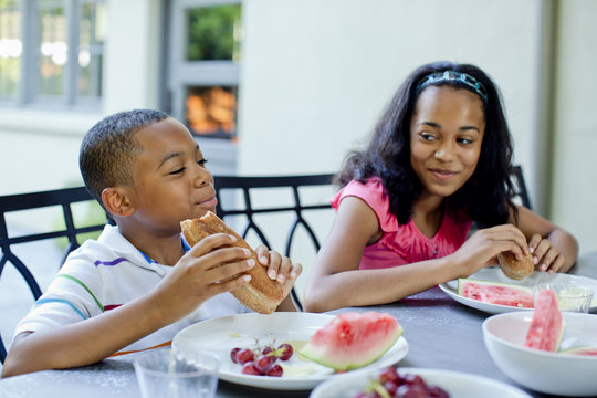 African American Children Eating Lunch Outdoors