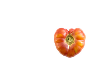 tomato in heart shape on white background 